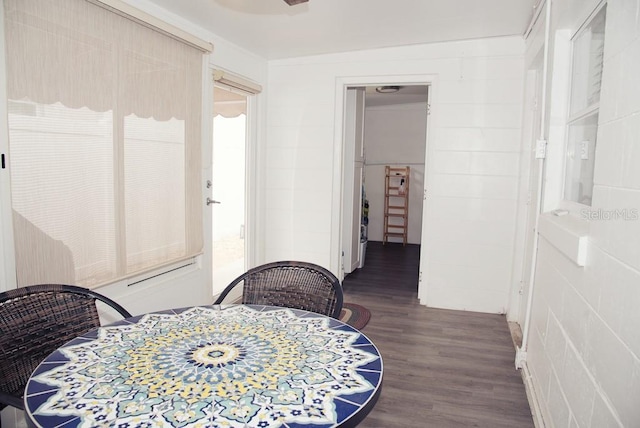 bedroom featuring ornamental molding and wood finished floors