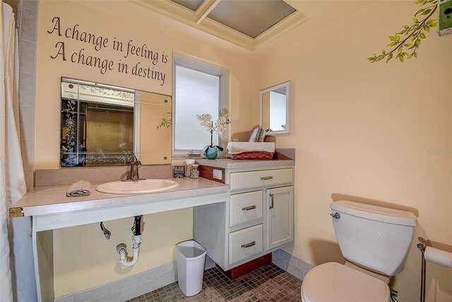 bathroom featuring vanity, toilet, and tile patterned floors