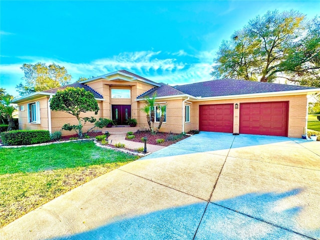 view of front facade with a garage, a shingled roof, brick siding, concrete driveway, and a front lawn