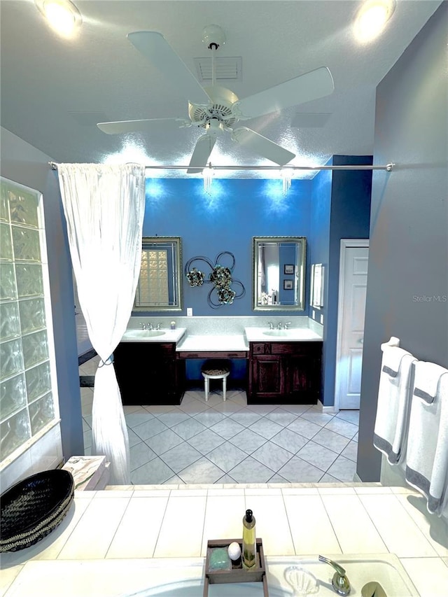 bathroom featuring double vanity, visible vents, a ceiling fan, tile patterned floors, and a sink