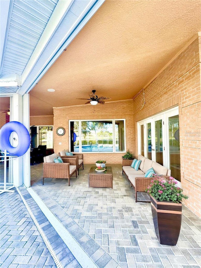 view of patio featuring ceiling fan, outdoor lounge area, and french doors