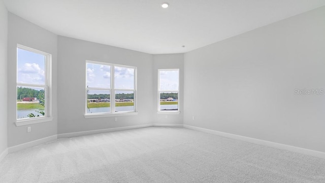 5646 Nevis Ter, Kissimmee, FL 34758 - carpeted empty room with baseboards and a water view