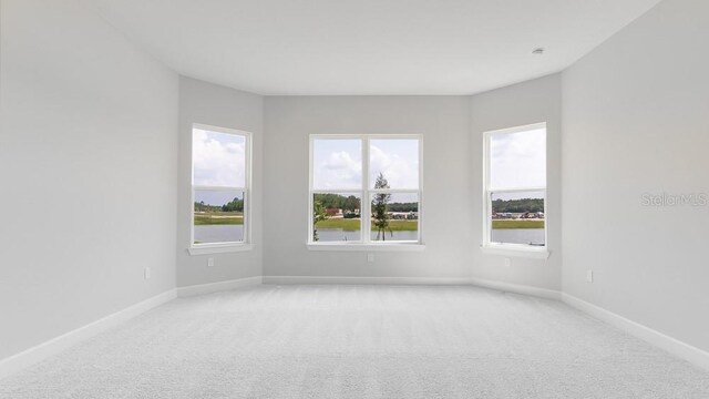 5646 Nevis Ter, Kissimmee, FL 34758 - unfurnished room featuring light carpet and baseboards
