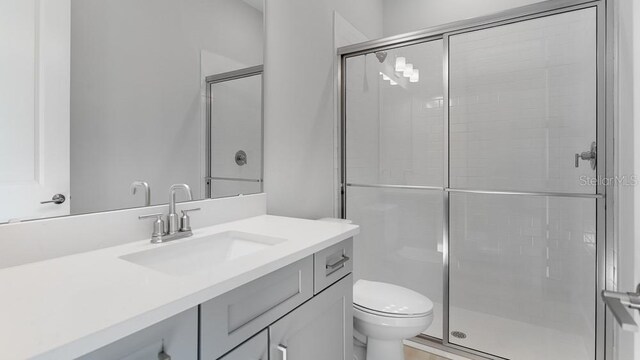 5646 Nevis Ter, Kissimmee, FL 34758 - bathroom with a stall shower, toilet, and vanity