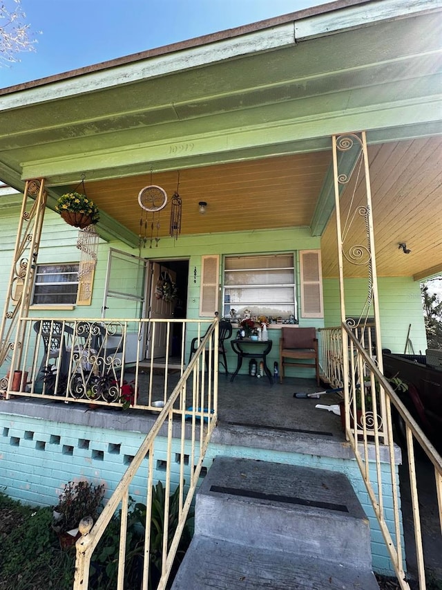 entrance to property with covered porch