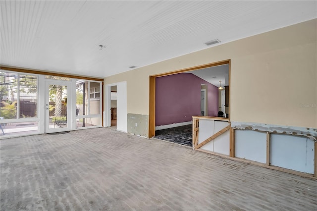 spare room featuring visible vents and wood finished floors