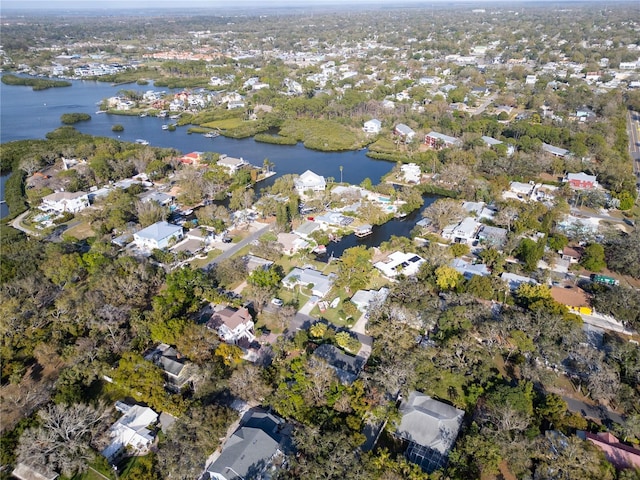 drone / aerial view with a water view and a residential view