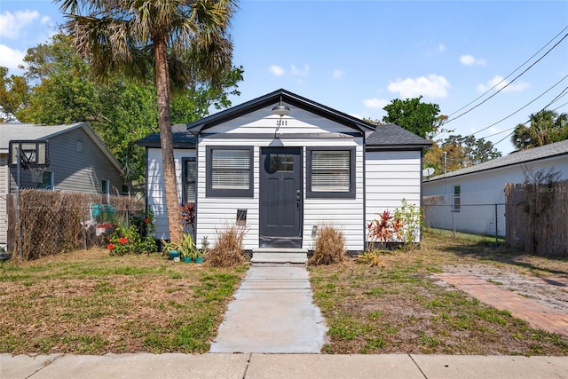 view of front of house featuring fence