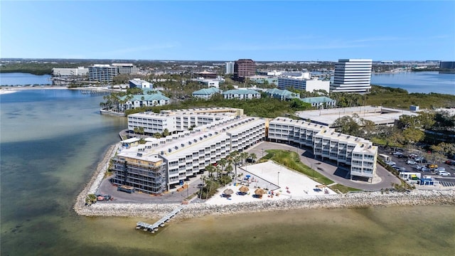 drone / aerial view featuring a water view and a view of city