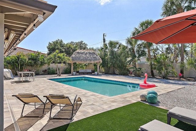 view of swimming pool featuring a gazebo, a patio area, a fenced backyard, and a fenced in pool