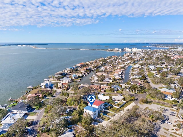 drone / aerial view featuring a water view and a residential view