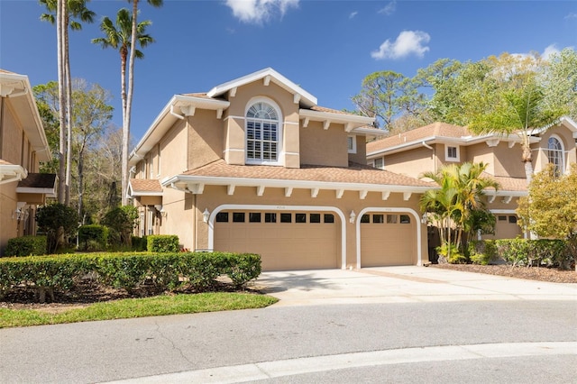 mediterranean / spanish-style home featuring driveway and stucco siding