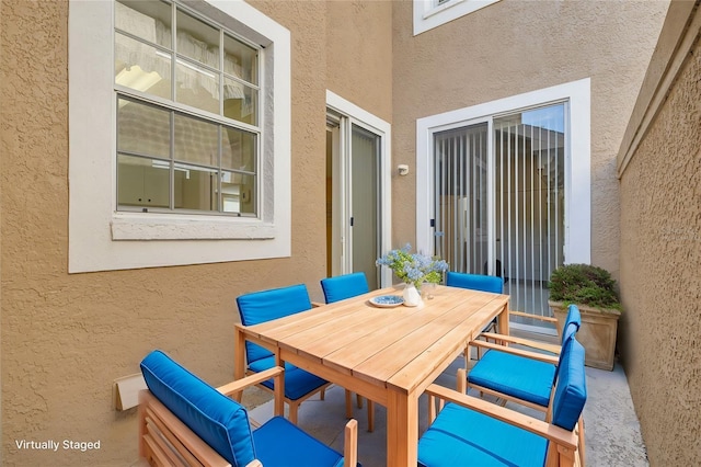 view of patio featuring outdoor dining area