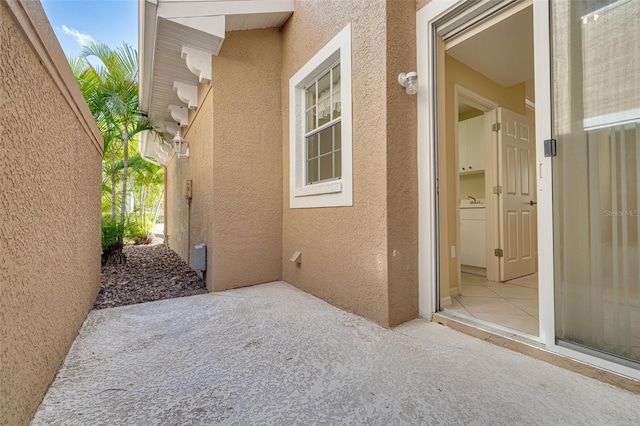 exterior space with a patio area and stucco siding