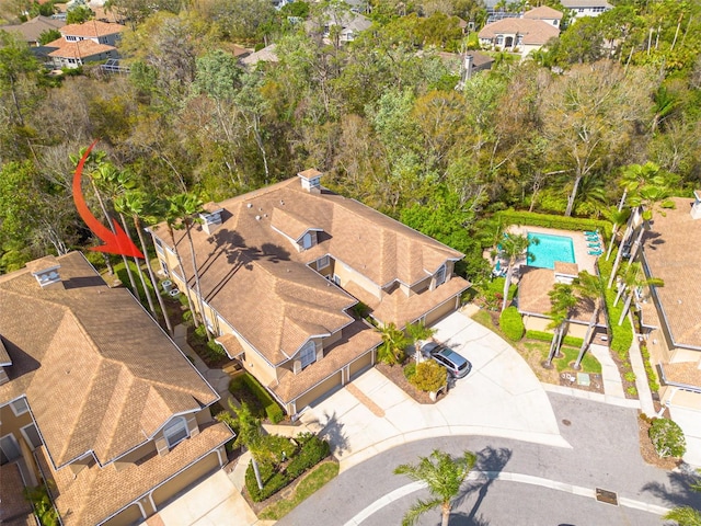 birds eye view of property with a residential view