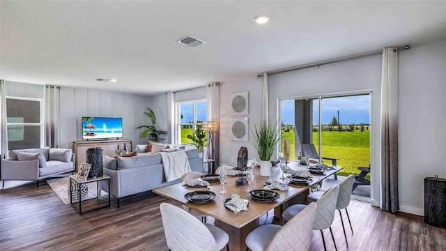 dining room with dark wood-style flooring and visible vents