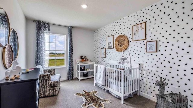 bedroom with baseboards, carpet, and wallpapered walls