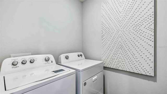 laundry room featuring washer and dryer and laundry area