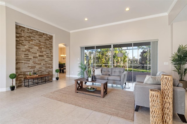 tiled living room with arched walkways, ornamental molding, recessed lighting, and baseboards