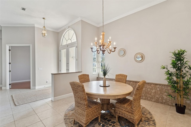 dining room with visible vents, crown molding, baseboards, and light tile patterned floors