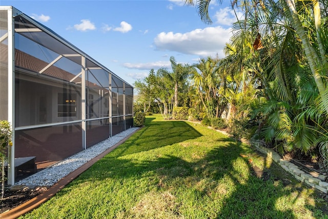 view of yard with a lanai