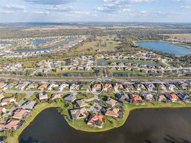 birds eye view of property with a residential view and a water view