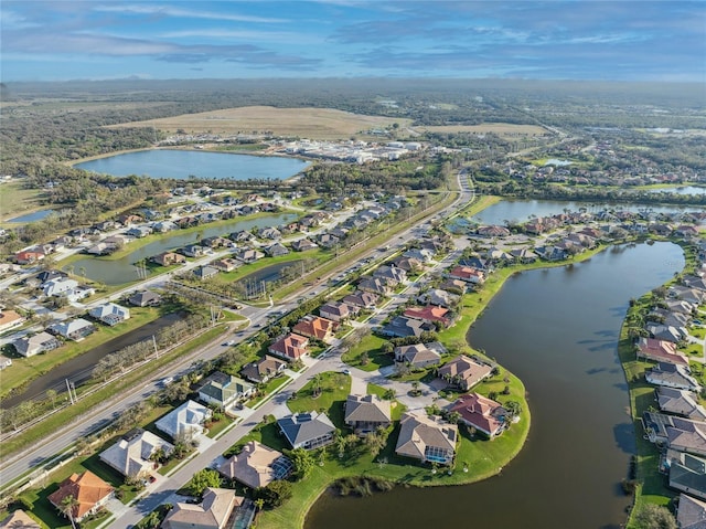 aerial view with a water view and a residential view