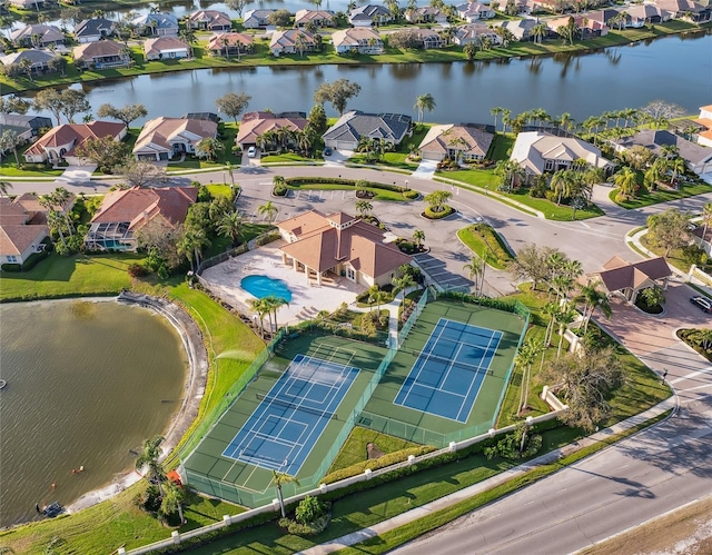 drone / aerial view with a water view and a residential view