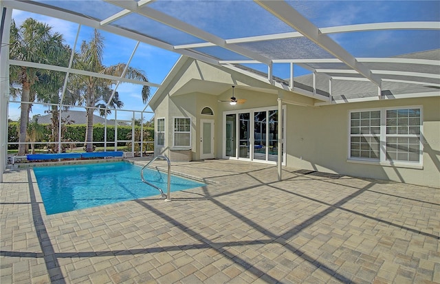 view of swimming pool with a lanai, a patio area, ceiling fan, and a fenced in pool
