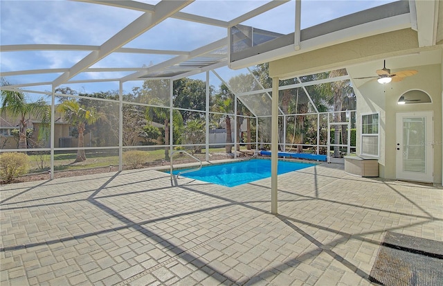 outdoor pool featuring a patio area, a lanai, and ceiling fan