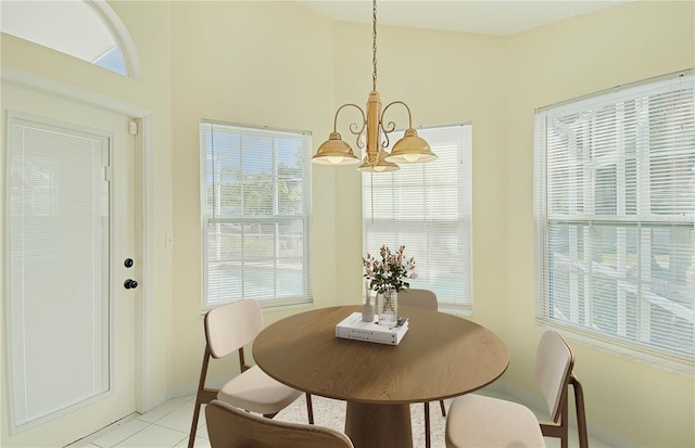 dining room featuring light tile patterned floors and a chandelier