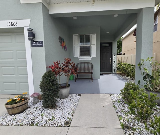 view of exterior entry featuring stucco siding