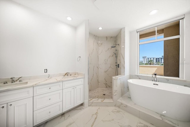 full bath featuring marble finish floor, a sink, a freestanding bath, and a marble finish shower