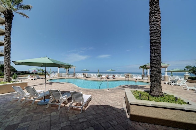 community pool with a patio area