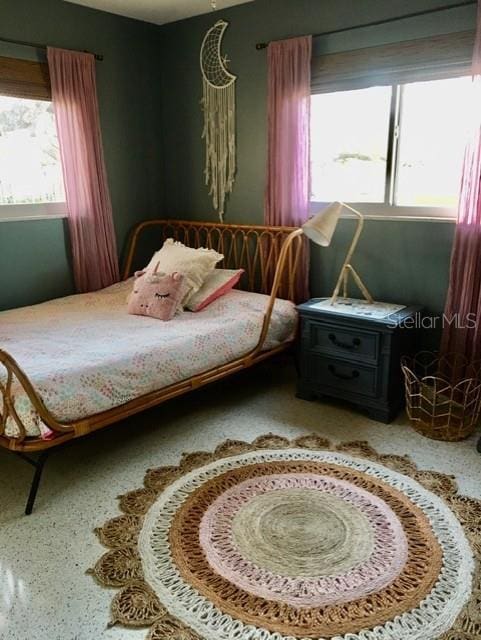 bedroom featuring multiple windows