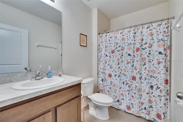 bathroom featuring a shower with shower curtain, toilet, a textured ceiling, vanity, and tile patterned floors