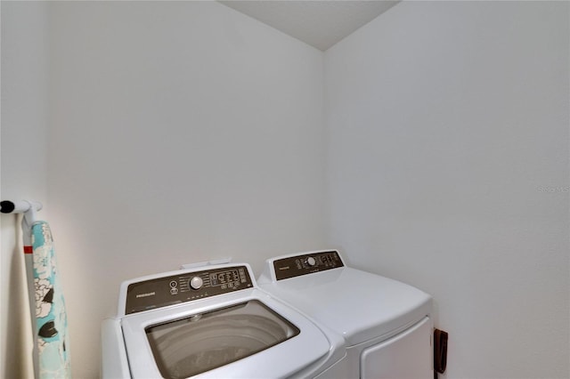 clothes washing area featuring laundry area and independent washer and dryer