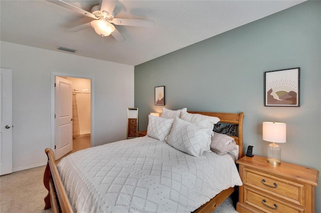 bedroom featuring baseboards, ceiling fan, visible vents, and carpet flooring