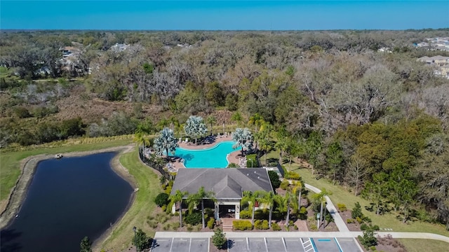 aerial view featuring a water view and a view of trees