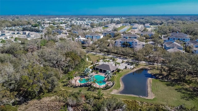 drone / aerial view featuring a water view and a residential view