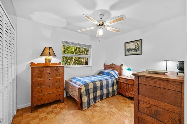 bedroom featuring ceiling fan and baseboards