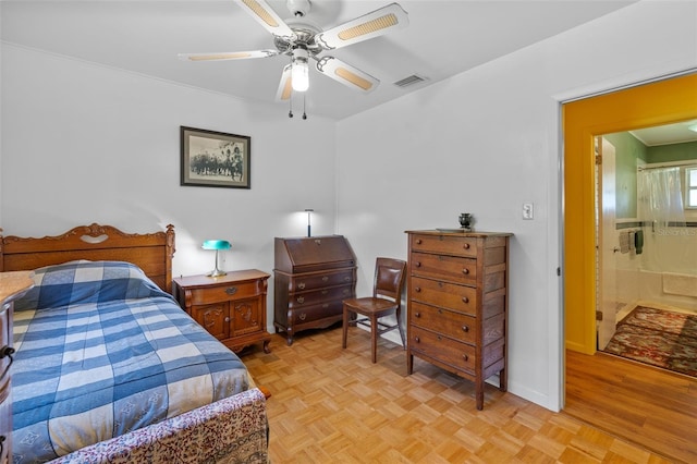 bedroom featuring baseboards, parquet flooring, visible vents, and a ceiling fan