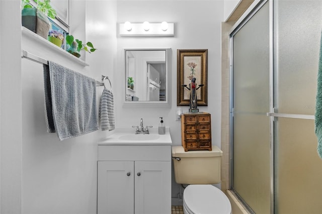 full bath with a shower stall, toilet, and vanity