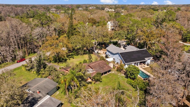 aerial view with a wooded view