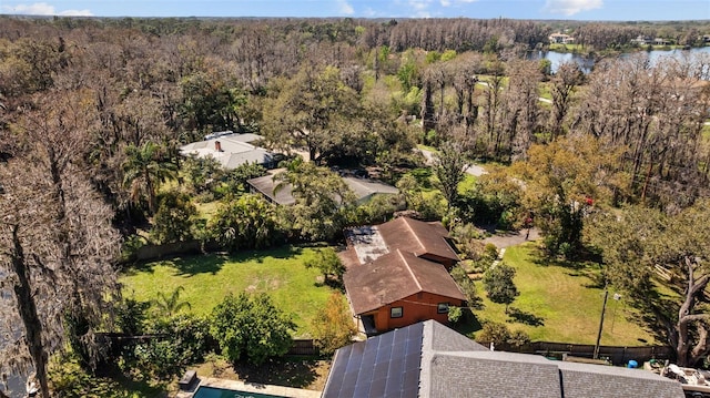 bird's eye view featuring a water view and a forest view