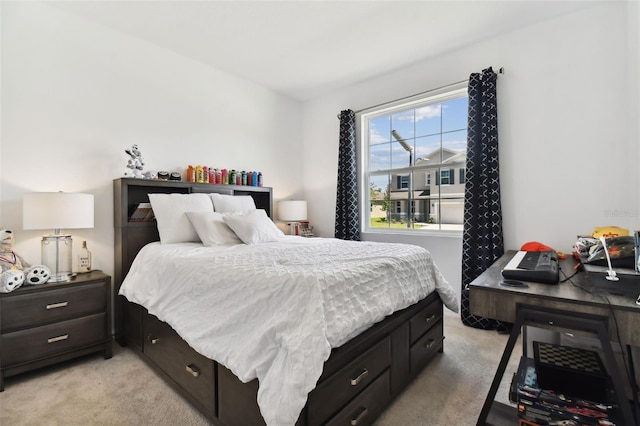 bedroom featuring light carpet