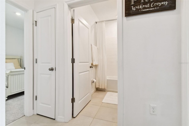 hallway featuring light tile patterned floors