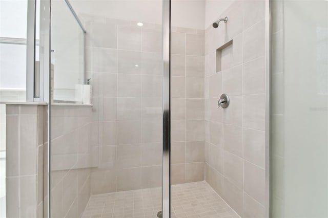 full bath featuring a shower stall