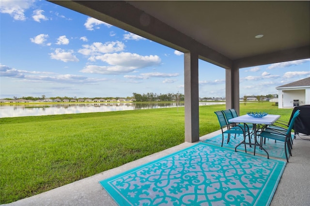 view of patio with a water view