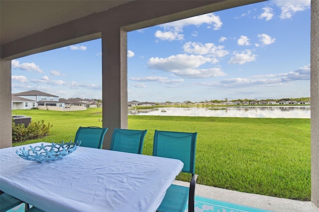 view of patio / terrace with a water view and central AC unit